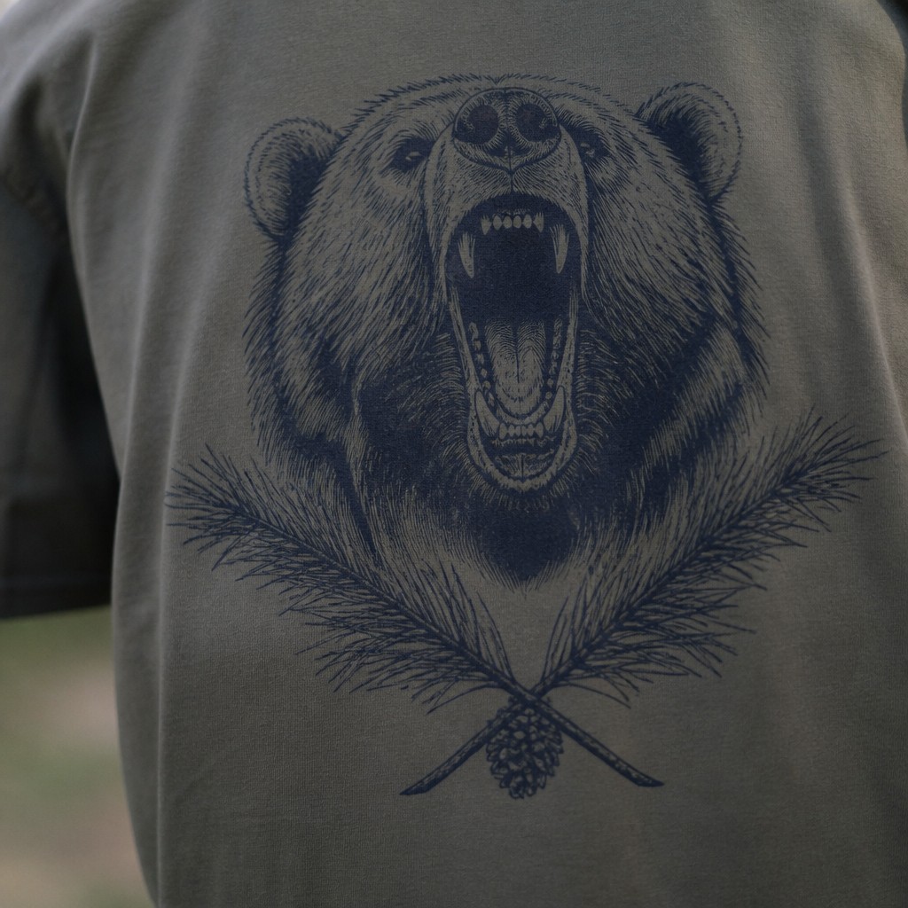 a roaring bear head above crossed pine branches, bold graphic composition on a plain background, no text