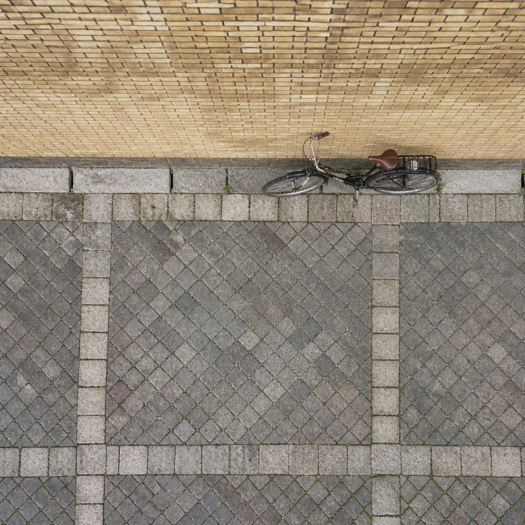 bicyle resting against a wall