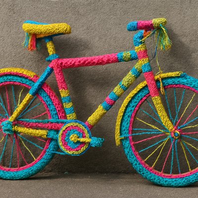 bicyle resting against a wall