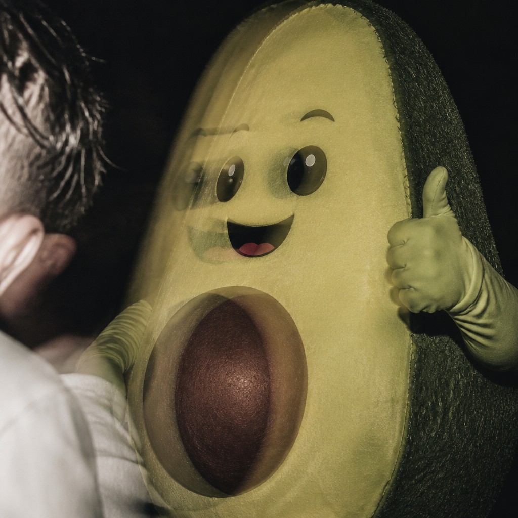a happy avocado character giving a thumbs up, bold readable design on a plain background, no text
