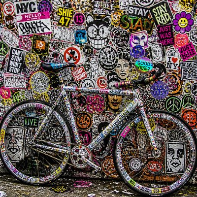 bicyle resting against a wall