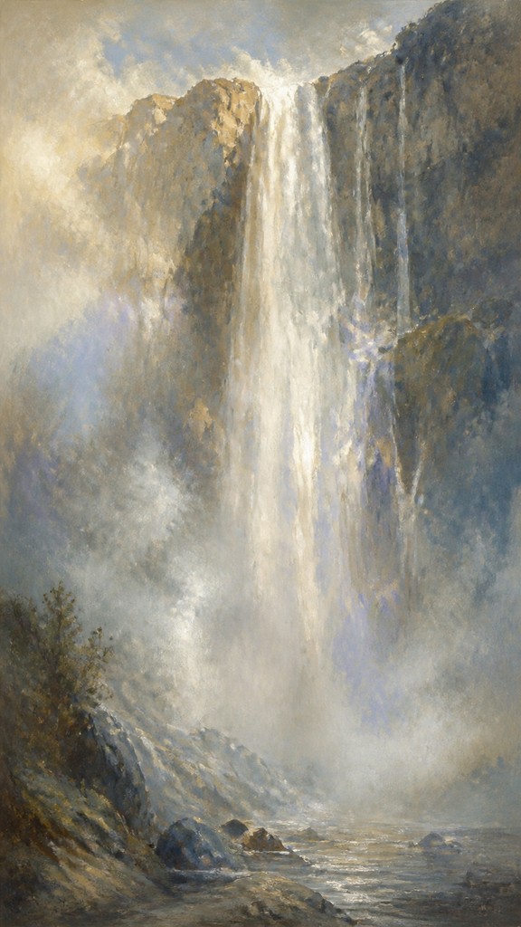 towering waterfall cascading down a cliff