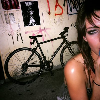 bicyle resting against a wall