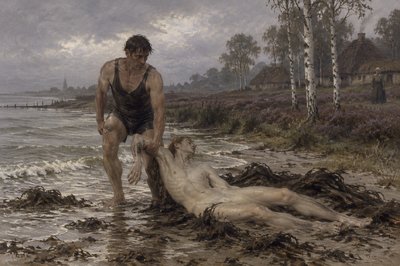 a mal swimmer walking on the beach rescues an ignudi athlete washed up on the beach 
