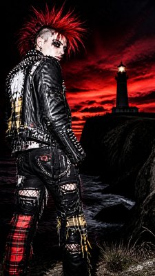 a lone lighthouse on a cliff at dusk under a dramatic sky, no text or lettering