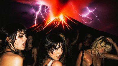 an erupting volcano with lightning strikes, dramatic wide composition, no text