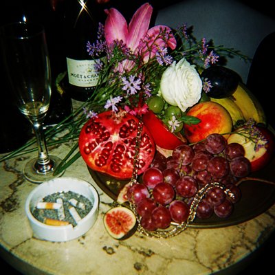 still life arrangement of fruits and flowers