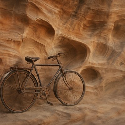 bicyle resting against a wall