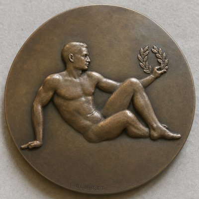 a bronze statue of a man holding a laurel