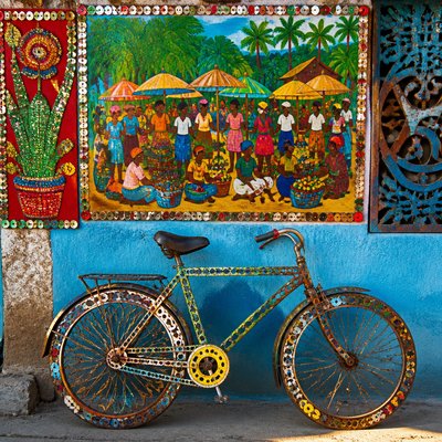 bicyle resting against a wall