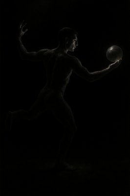a black and white photo of a man playing with a ball