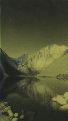 a tranquil mountain lake beneath a starry night sky, no people, no text