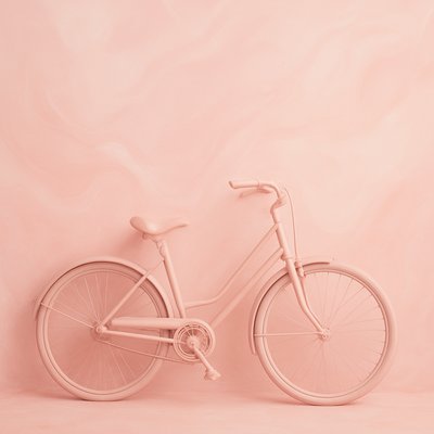 bicyle resting against a wall