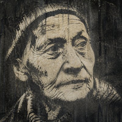 close-up portrait of an elderly person with expressive weathered features