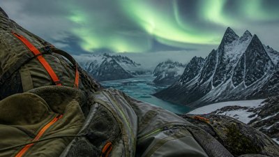 a flowing aurora over snowy peaks, wide sweeping composition, no people, no text