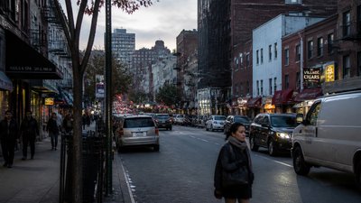 bustling city street panorama at dusk