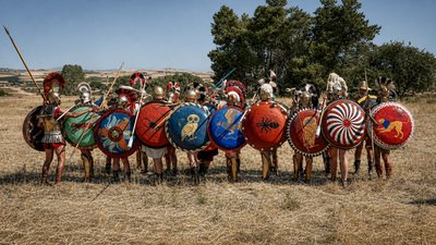 a group of men in roman armor standing next to each other