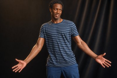a man standing with his hands out in front of him