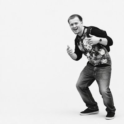 a man in a black and white photo giving a thumbs up