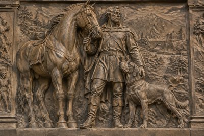 sculpture of a horse, man, and dog close together