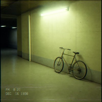 bicyle resting against a wall