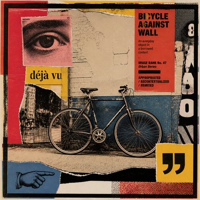 bicyle resting against a wall