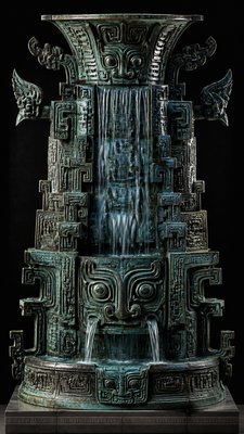 towering waterfall cascading down a cliff
