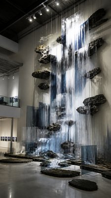 towering waterfall cascading down a cliff