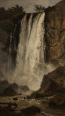 towering waterfall cascading down a cliff