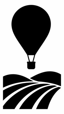 a hot air balloon drifting over rolling flower fields on a sunny day, cheerful, no text
