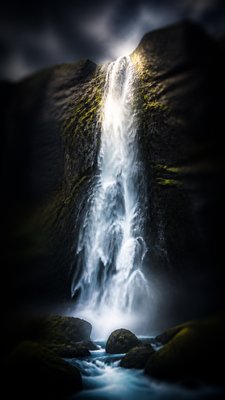 towering waterfall cascading down a cliff