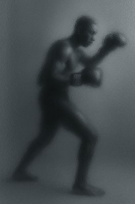 a black and white photo of a man in a boxing stance