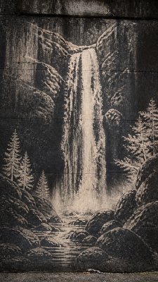 towering waterfall cascading down a cliff
