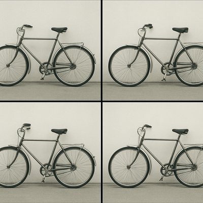 bicyle resting against a wall
