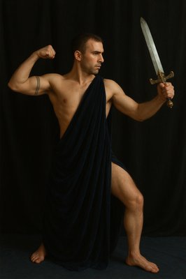 a man in a towel holding a sword