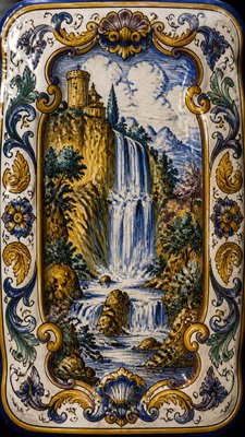 towering waterfall cascading down a cliff