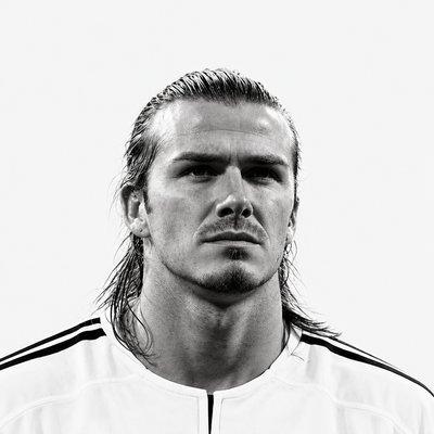 a black and white photo of a man with long hair