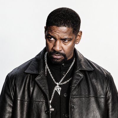 a man in a leather jacket with a chain around his neck