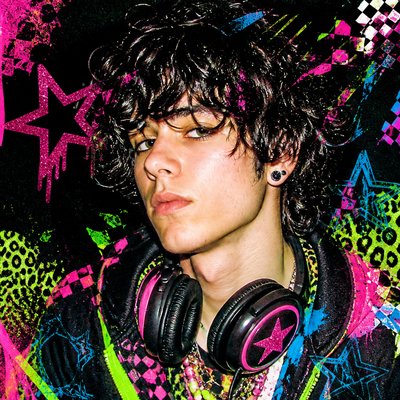head-and-shoulders portrait of an original character: a young man with curly dark hair and headphones around his neck, plain backdrop, no text