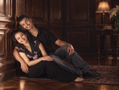 a man and a woman sitting on the floor