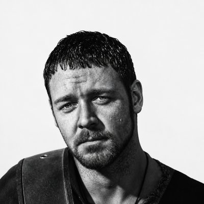 a black and white photo of a man with a beard