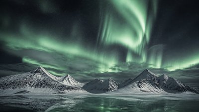 a flowing aurora over snowy peaks, wide sweeping composition, no people, no text