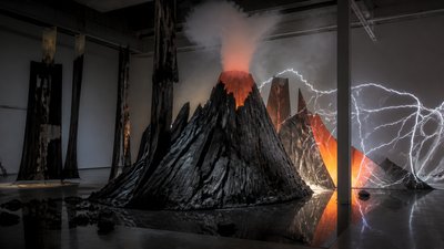an erupting volcano with lightning strikes, dramatic wide composition, no text