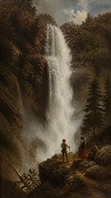 towering waterfall cascading down a cliff