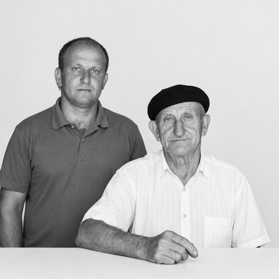 a black and white photo of two men