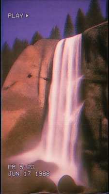 towering waterfall cascading down a cliff