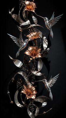 a climbing vine of flowers and hummingbirds on a dark background, tall wrapping composition, no text