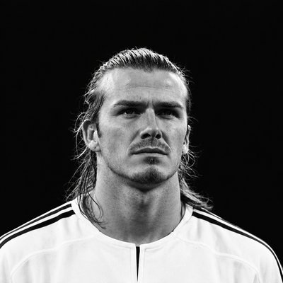 a black and white photo of a man with long hair