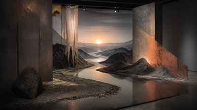 a vast valley with a river winding toward distant mountains at sunrise, no people, no text