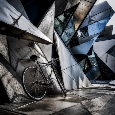 bicyle resting against a wall — Deconstructivist Architecture